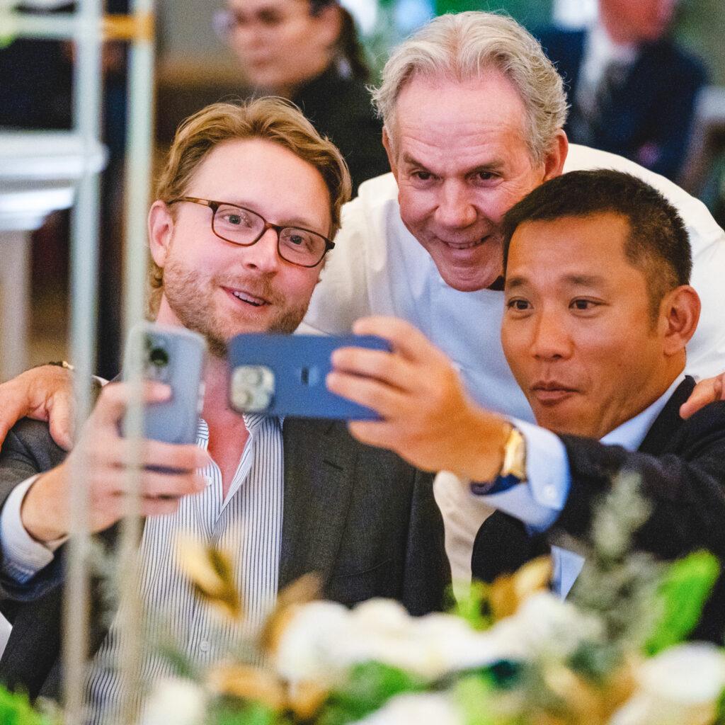Patrick Nichols with takes a selfie with chef Thomas Keller and restaurateur Simon Kim.