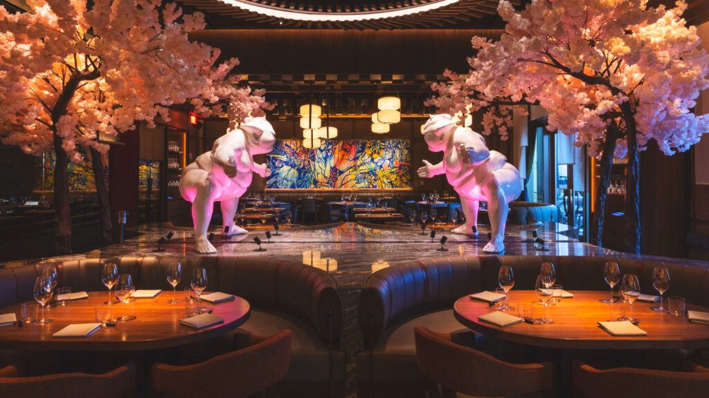 A Japanese restaurant at the Venetian features two statues of sumo wrestlers and artificial cherry trees