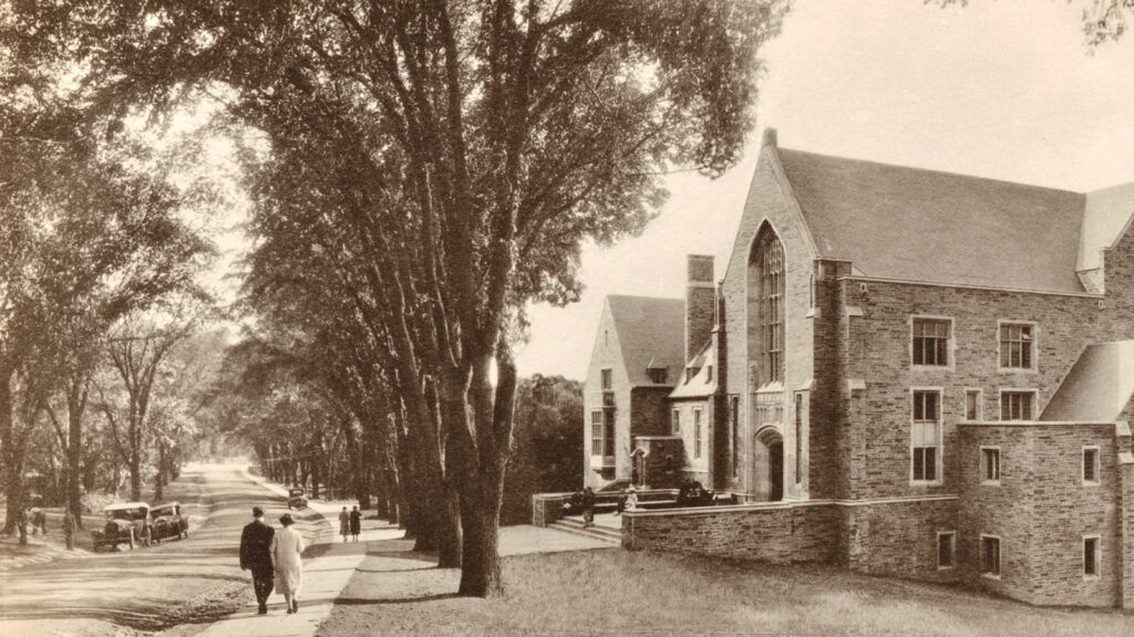 a double row of elm trees along Central Avenue in front of the newly opened Willard Straight Hall in the 1920s