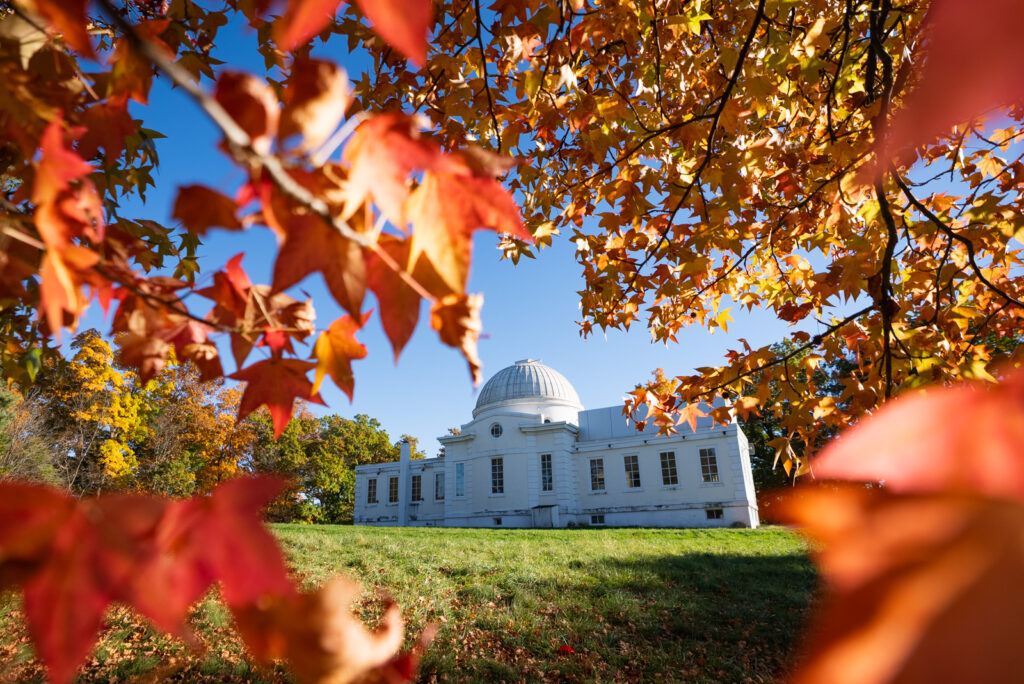 Fuentes Observatory surrounded yellow and orange fall foliage.