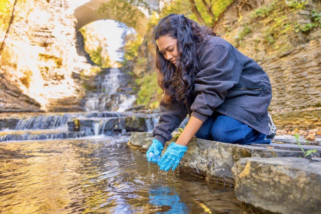 Madeline Adams ’27 takes a water sample