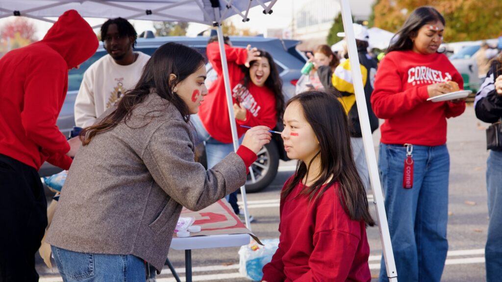 students took part in face painting in the Crescent Lot before the game