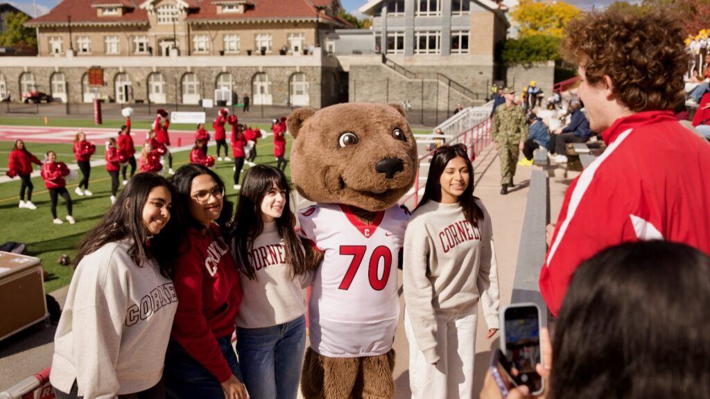 Touchdown poses with fans at Schoellkopf during the game