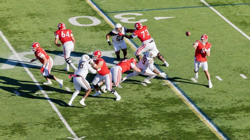 A Cornell player throws the ball down field.