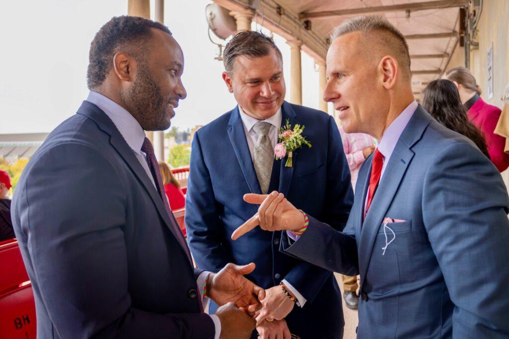 Nelson Ahonsi MPS '23 Jeffry Clausen MS '26 and Judge Miller '90 JD '95