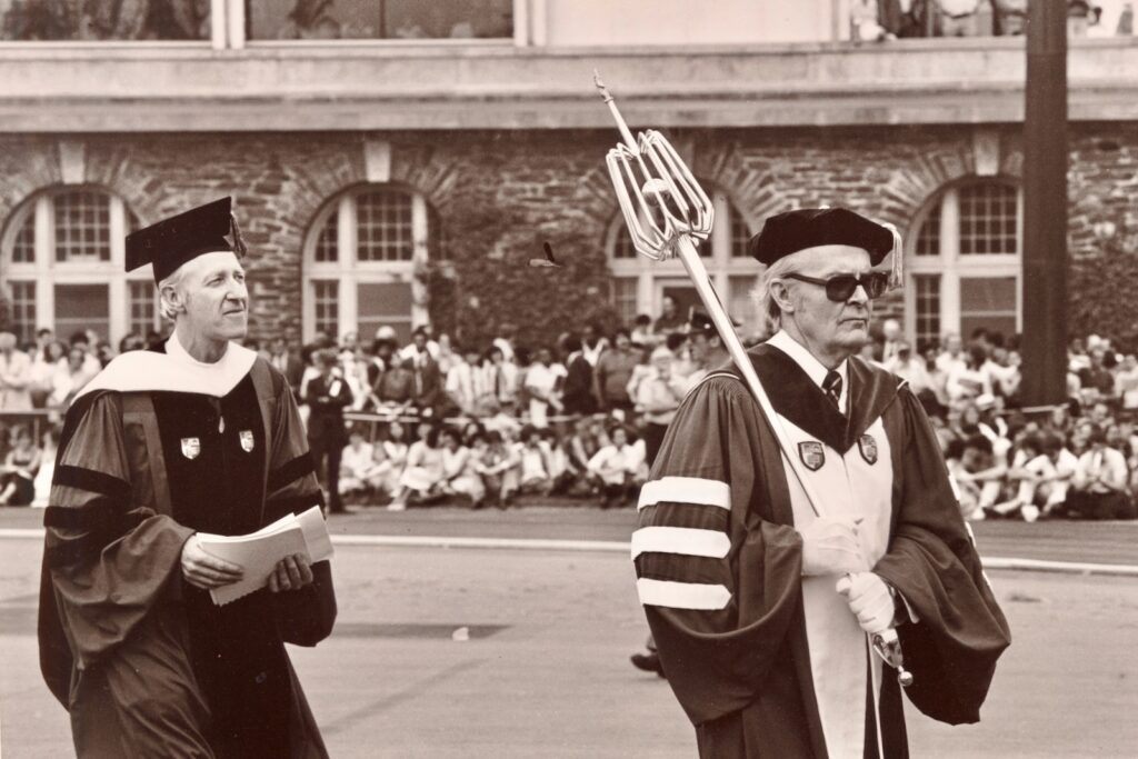 Frank H.T. Rhodes, left, during the academic procession into Schoellkopf in 1982, along with mace bearer Frank Barton Miller