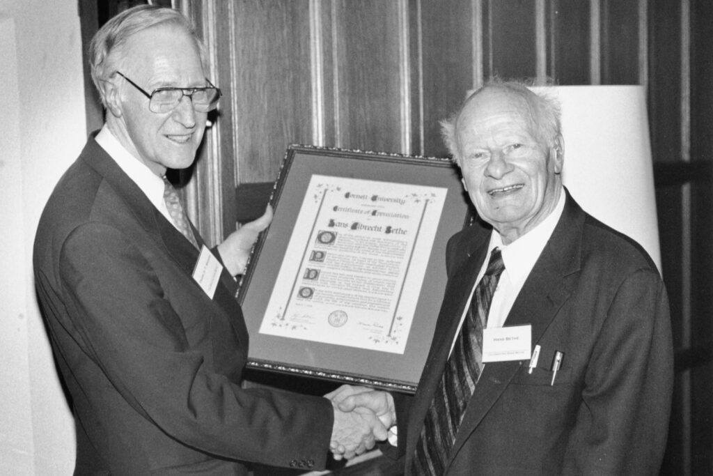 President Frank H.T. Rhodes presents a certificate of appreciation to Hans Bethe in 1995