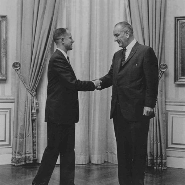 Craig Voorhees shaking hands with President Lyndon B. Johnson