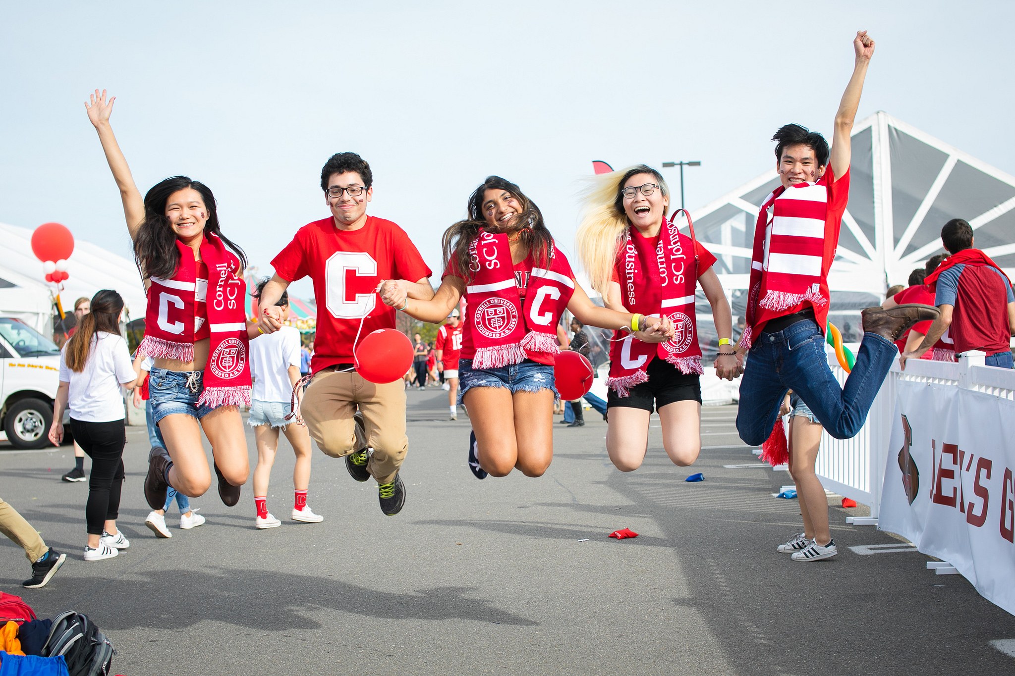 Student events. Student Jump. Cornell University big Red. Students wearing Sports Team Clothing.