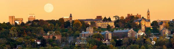 A panoramic of campus during an autumn sunset (with full moon rising) from the west hill.
