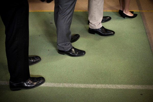 Students line up to meet recruiters at a career fair.