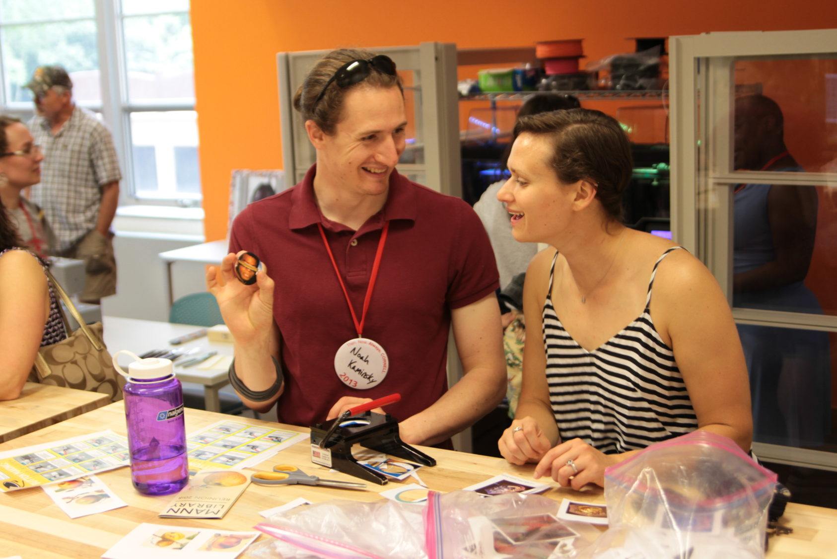 Noah Kaminsky ’13 shows off the Star Trek-themed button he made at the mannUfactory makerspace open house in Mann Library.