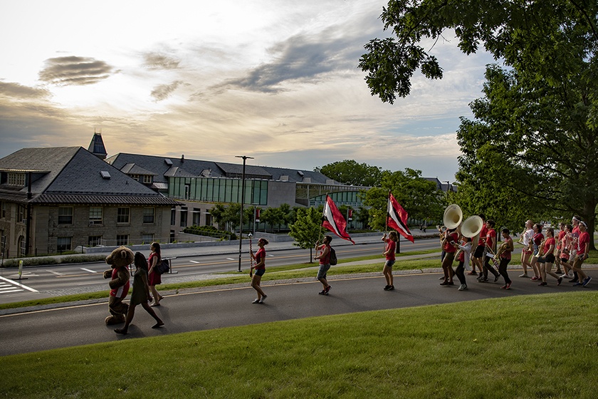 Alumni of the Big Red Bands march toward the Arts Quad.