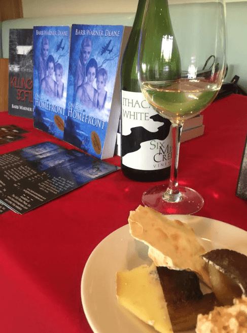 Table display of books, wine and cheese