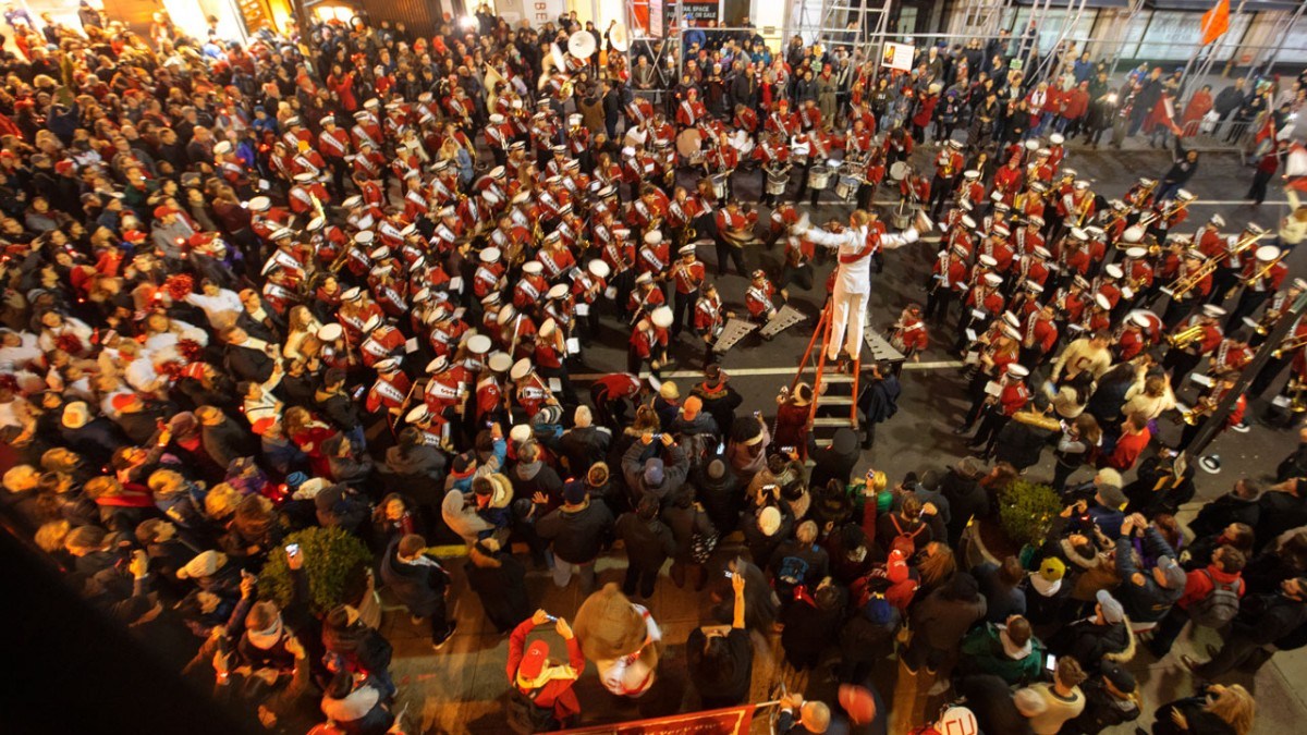 The Big Red Marching Band plays outside the Cornell Club-New York.