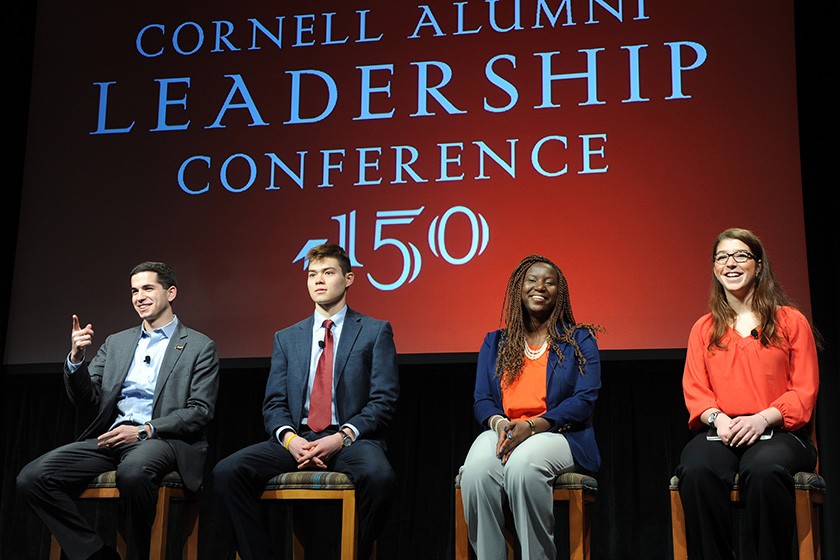 Four students on stage at CALC 2015.