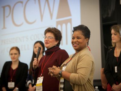 Alumnae gathered on stage.