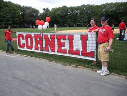 People hold Cornell banner