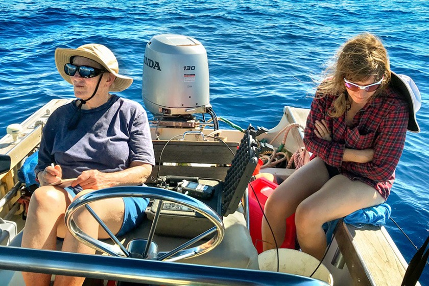 Two women on a small boat, with recording equipment