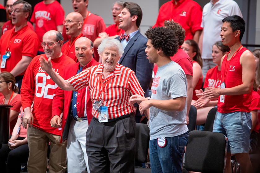 Cornell Glee Club alumni lead the singing.