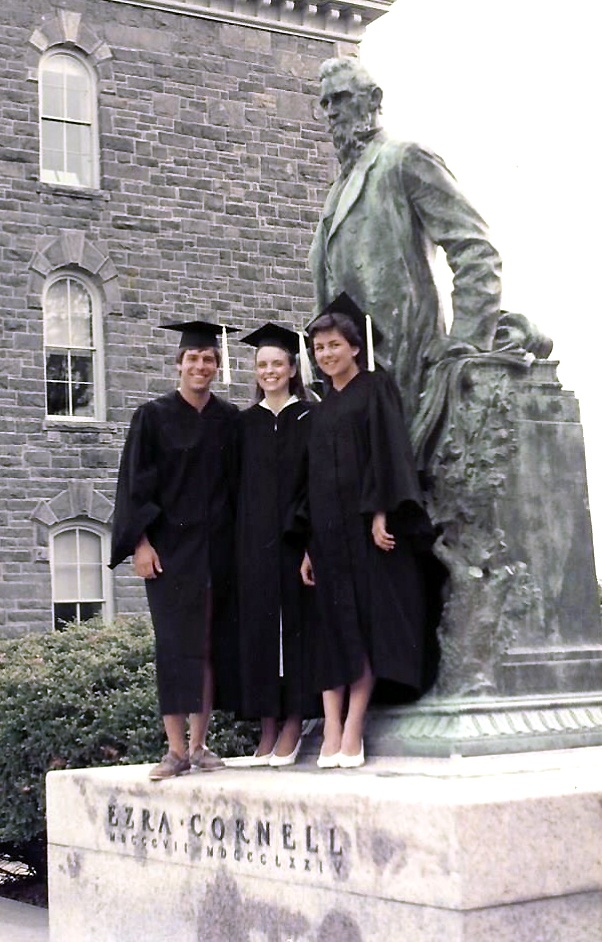 Graduation 1984: (left to right) Ted Clark, Christine Miller Whaley, and Terri Port beside the statue of Ezra Cornell.