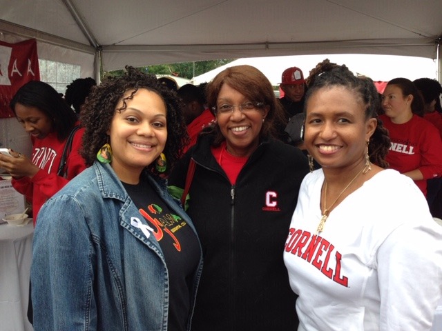 Cynthia Cuffie with two friends, wearing Cornell gear