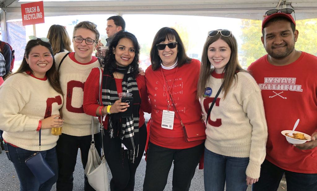 Young alumni join President Martha Pollack in celebrating generations of Big Red pride at Homecoming.