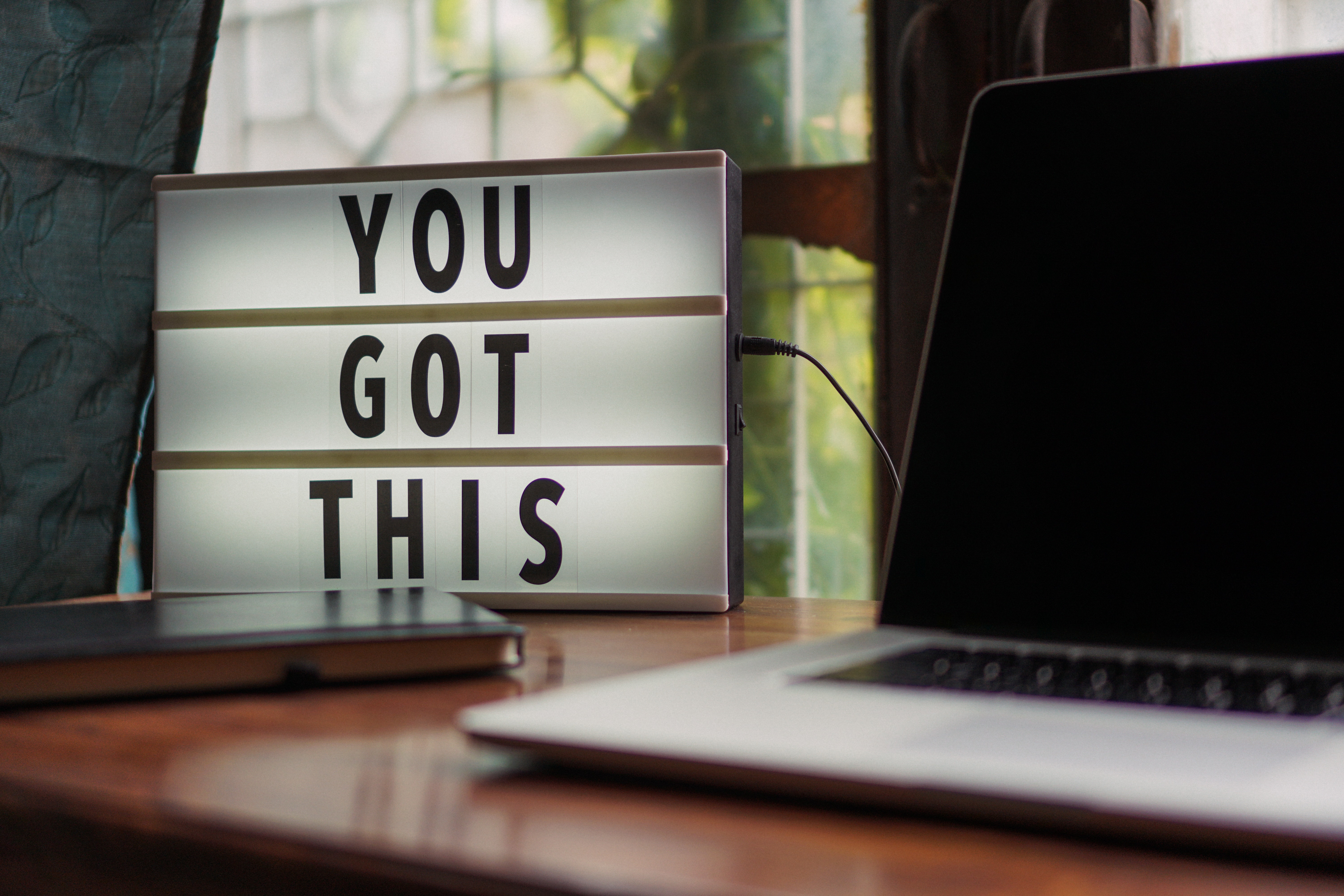 laptop and "you got this' sign