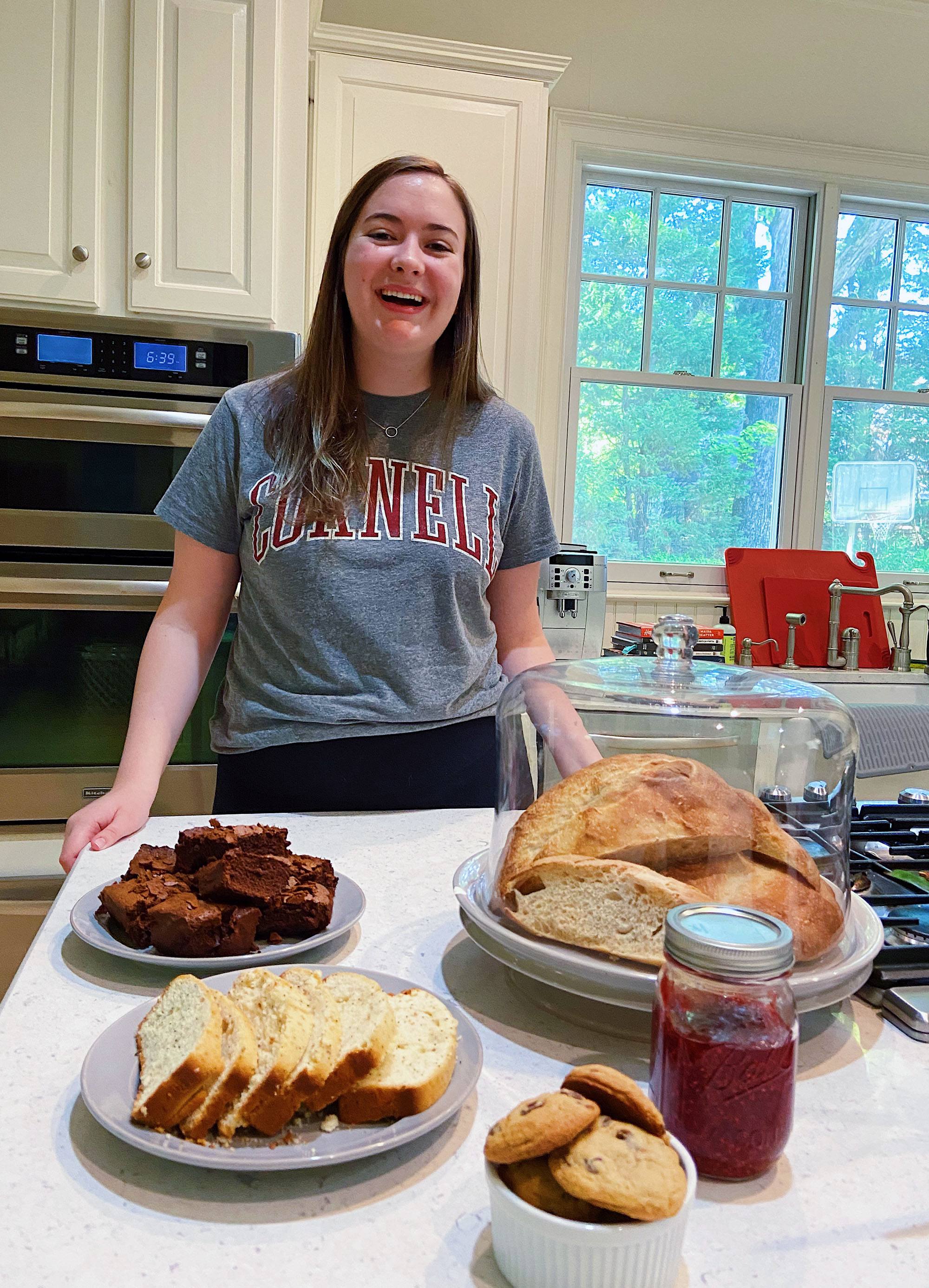 Colesy with a few of the things she’s baked in the past week: lemon poppy-seed tea cake, raspberry jam, chocolate chip cookies, magic espresso brownies, and extra tangy sourdough bread!