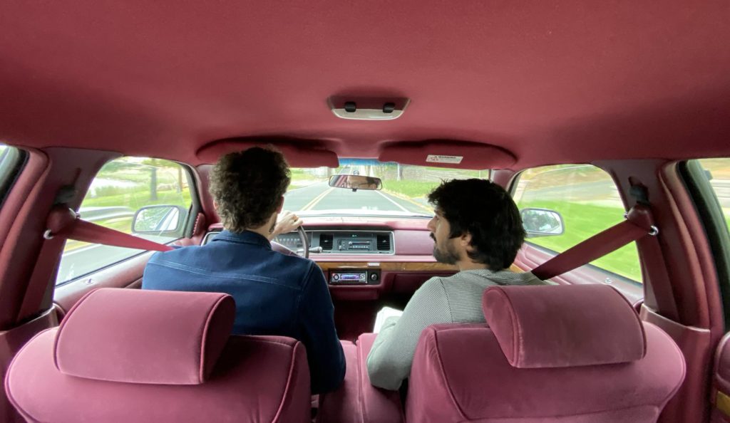 Alex and a friend driving north of NYC, somewhere near the Connecticut line.