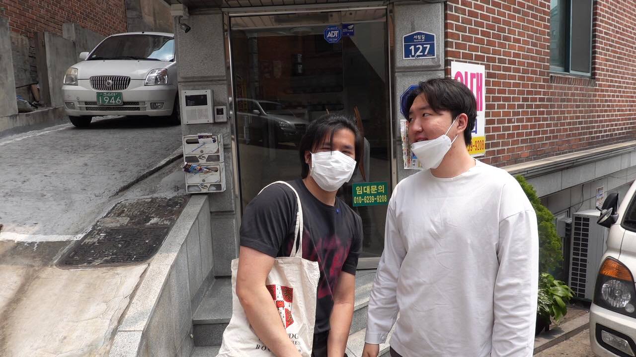 Eric (left) on his first day out of quarantine in Seoul. “My hair is very messy because I couldn't get it trimmed in the States,” he says.