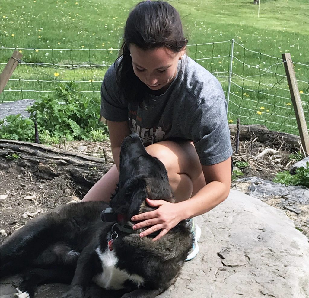 Rachel playing with Gator, her puppy.