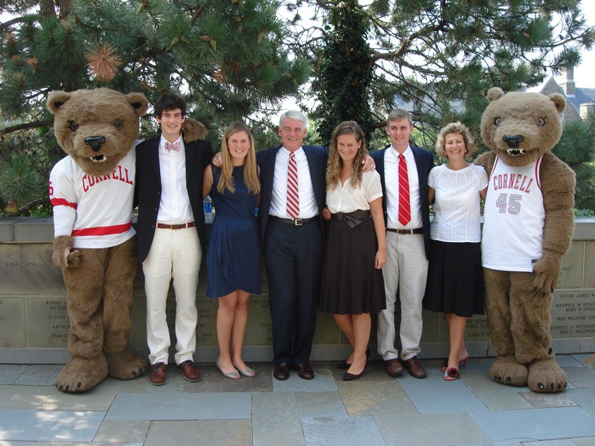 Zachary Alexander ’13, Kathleen Alexander ’08, John Alexander ’74, Tina Alexander, Nick Alexander ’12, and Elaine Alexander ’77 are flanked by Touchdown, and his Touchdown twin, following the Cornell Foremost Benefactors recognition on Cornell’s Ithaca campus in 2009.