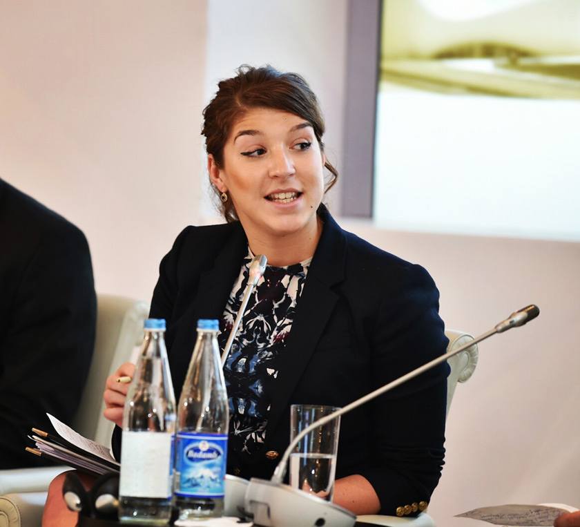Juliana Batista speaking at the Nizami Ganjavi International Center in Azerbaijan on women's issues.