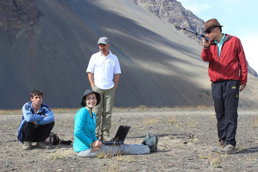 Karim-Aly Kassam and the Ecological Calendars Research Team enjoy a pleasant moment while Isabell Haag, PhD candidate at the University of Bayreuth, downloads climate data from sensors in the Pamir Mountains. 