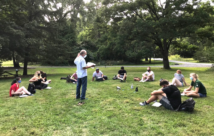 Professor Louis A. Derry working with his biogeochemistry students on a soil carbon experiment at Cornell Botanic Gardens.