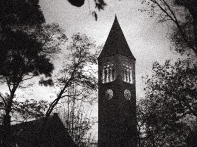 black and white grainy creepy campus tower photo