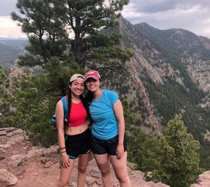 Maya with her sister Asia on Bear Peak in Boulder, Colorado, in May 2021