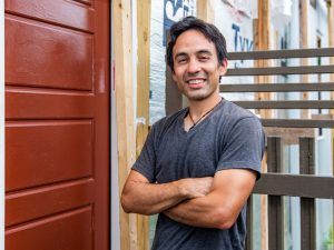 Alex Villagomez ’03 at the door of the house he is building, Casa Linda