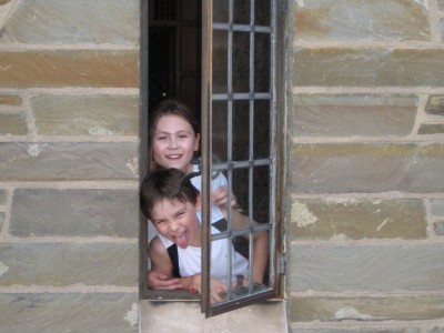 enata Geer's ’82 children, Maya and Lukas, pose in a window at Willard Straight Hall in 2010