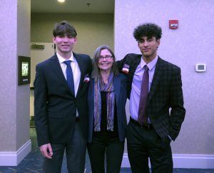 Lukas, Renata, and Lukas’s friend and teammate, Bryce, at a baseball season kickoff dinner in December 2019