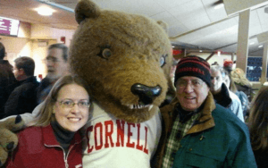 Dr. A’ndrea L. Van Schoick ’96 and her dad with Touchdown the bear