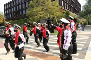 The BRMB parading outside of Uris Hall during Homecoming weekend