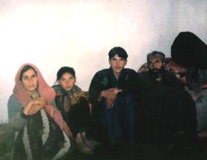 Farid (center) with his family in 2002