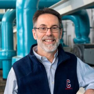 Lanny Joyce ’81, retired director of Utilities and Energy Management, at Cornell’s Lake Source Cooling facility. Credit: Cornell University