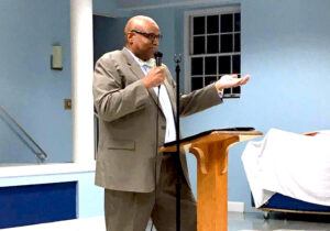 Rodney talking about retirement in a church in Alexandria, Virginia