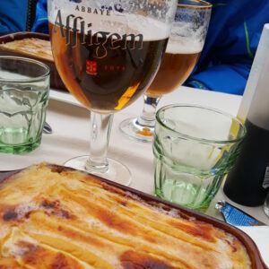 Enjoying Tartiflette, a traditional Alpine dish