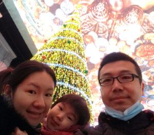 Enjue, his wife Jin, and their daughter Alice at a mall in Beijing earlier this winter