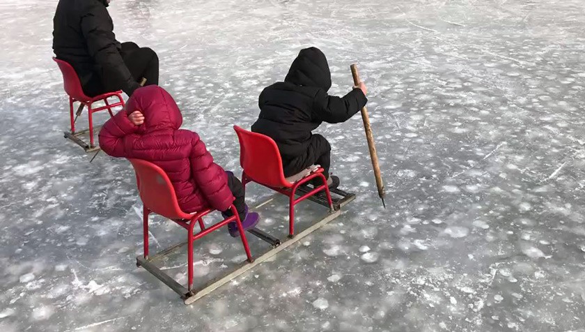 Enjue Wang MEng ’08 shared this photo of his children, Andrew and Alice, riding in the open sleigh, “just like the old days.”