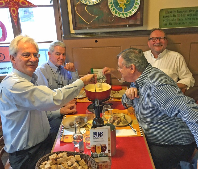 Bernie MacCabe ’75, MBA ’79 enjoying a traditional fondue with friends in Switzerland